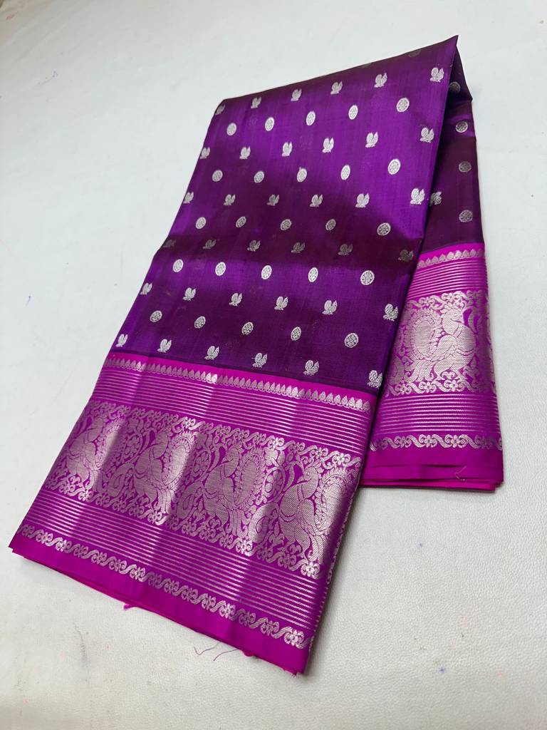 Traditional Purple Handloom Venkatagiri Pattu Saree with Silver Zari Buttas and Rich Woven Peacock Border