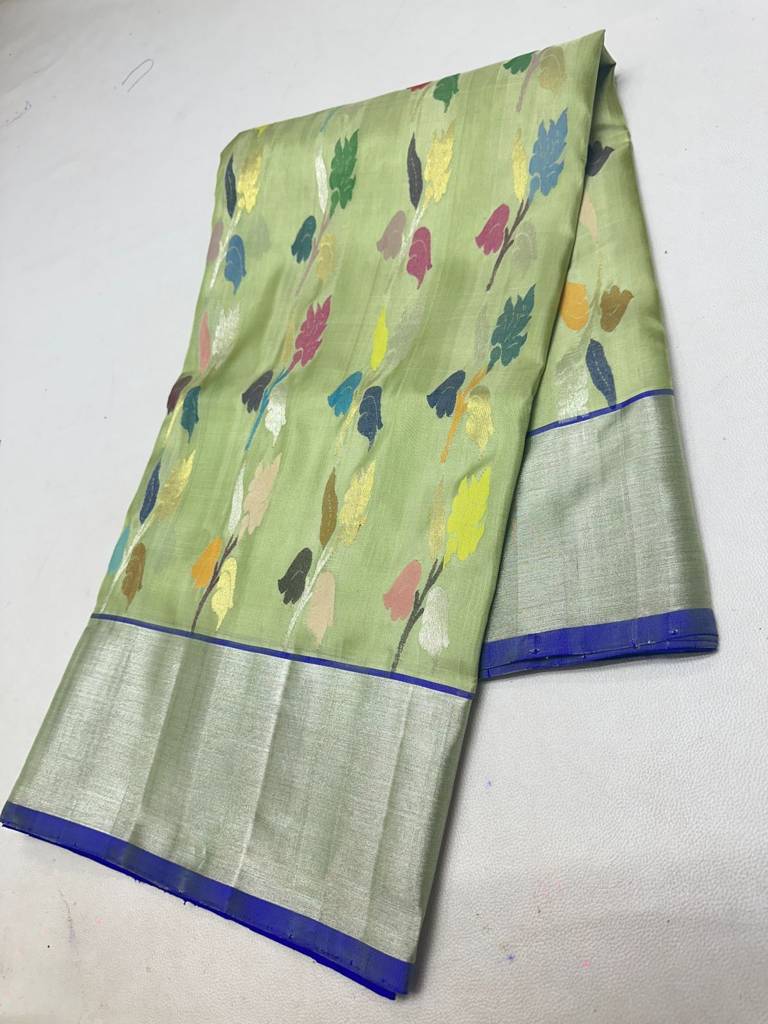 Traditional Light Green Handloom Venkatagiri Pattu Saree with Multicolour Floral Buttas and Rich Silver Zari Border