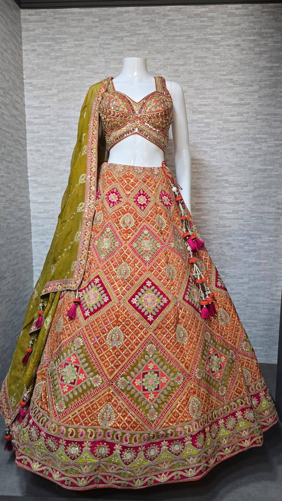 Orange and Pink Heavy Embroidered Lehenga Choli with Olive Green Dupatta 